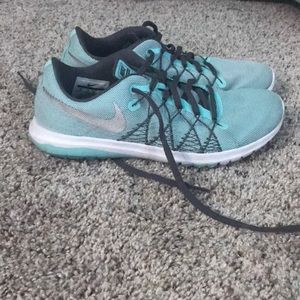 Aqua and gray Nike tennis shoes